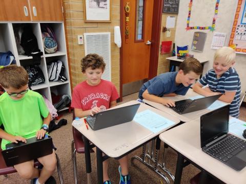 students researching on chromebooks
