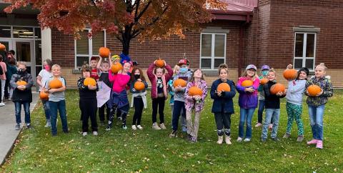 students with their pumpkins
