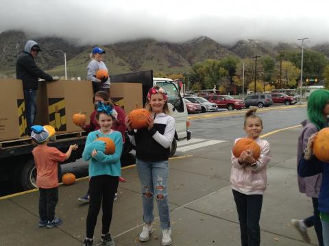 student council reading to hand out their pumpkins