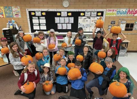 Miss White's class with their pumpkins.