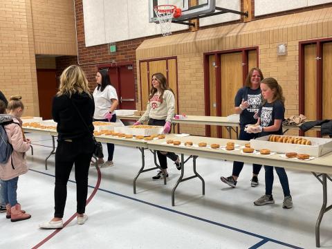 Our PTA handing our donuts