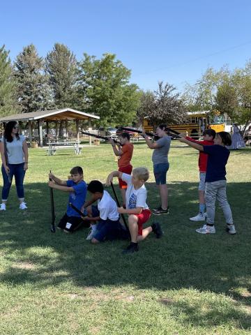 students learning to shoot a musket