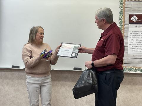 Mrs. Val Seitz receiving her award from Craig Harvey agency
